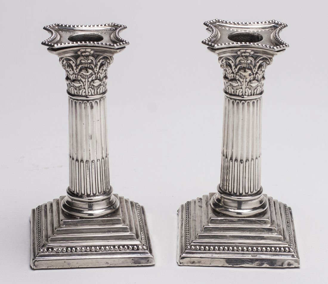 English 1897 Sterling Silver Repousse Candlesticks: Pair of Edwardian Sheffield Sterling Silver Repousse Candlesticks. Hallmarked London 1897, with makers mark William Hutton & Sons Ltd. The weighted candlesticks are in good condition with light dents