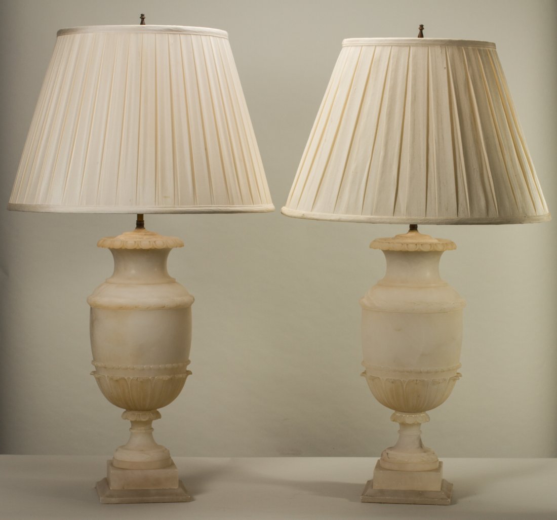 Pair of Classic 36" Old Carved Alabaster Urn Form Lamps: Pair of Large Carved Alabaster Urn Form Lamps. The decorative and classic lamps have acanthus leaf decoration. In good condition. The alabaster measures 20" in height and the lamps measure 36 inches i