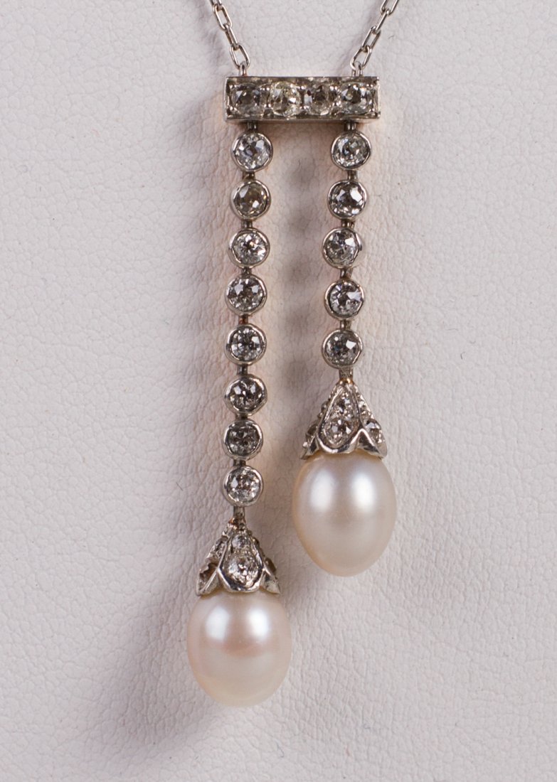 Edwardian 14K Gold Teardrop Pearl and Diamond Necklace: Edwardian 14K Teardrop Pearl and Diamond Necklace. The unmarked 14 karat white gold necklace has a delicate linked chain and the drop is composed of a straight bar at the top set with four .06 diamond