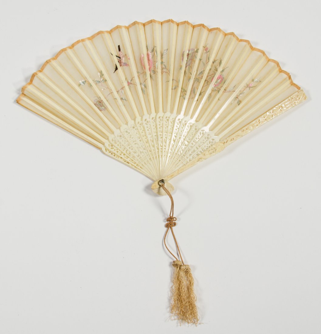 Antque Chinese Carved Bone and Embroidered Silk Fan: Old Chinese Bone and Embroidered Decorative Silk Fan. Pierce carved bone with silk covering depicting birds on tree branches with flowers. Mother of pearl spacers on the toggle. In good condition, wit