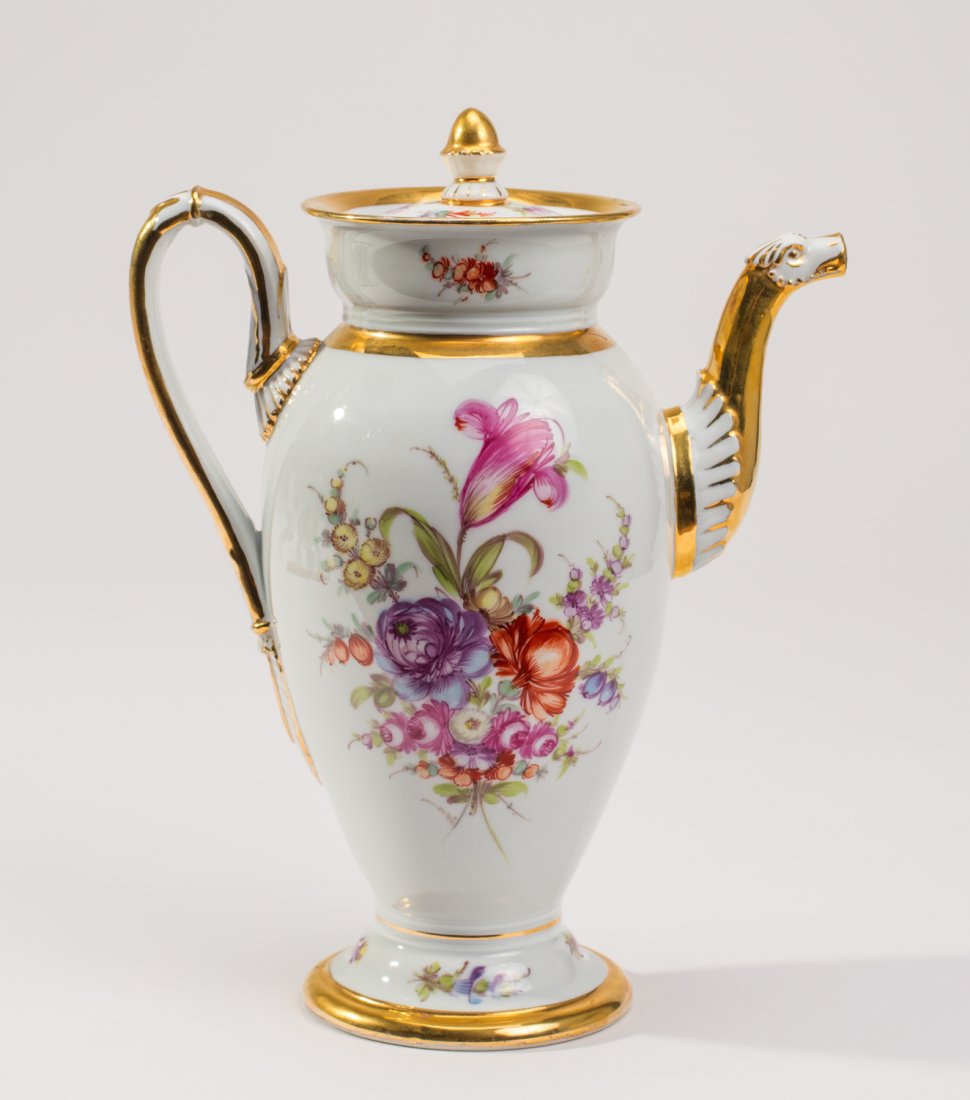 Ornate Meissen German Porcelain Floral Gilt Coffee Pot: Meissen German Porcelain Floral Gilt Coffee Pot. Finely hand decorated with gilt borders and painted florals on the body. In good condition. Under glaze blue crossed swords mark. Measures 10 inches in