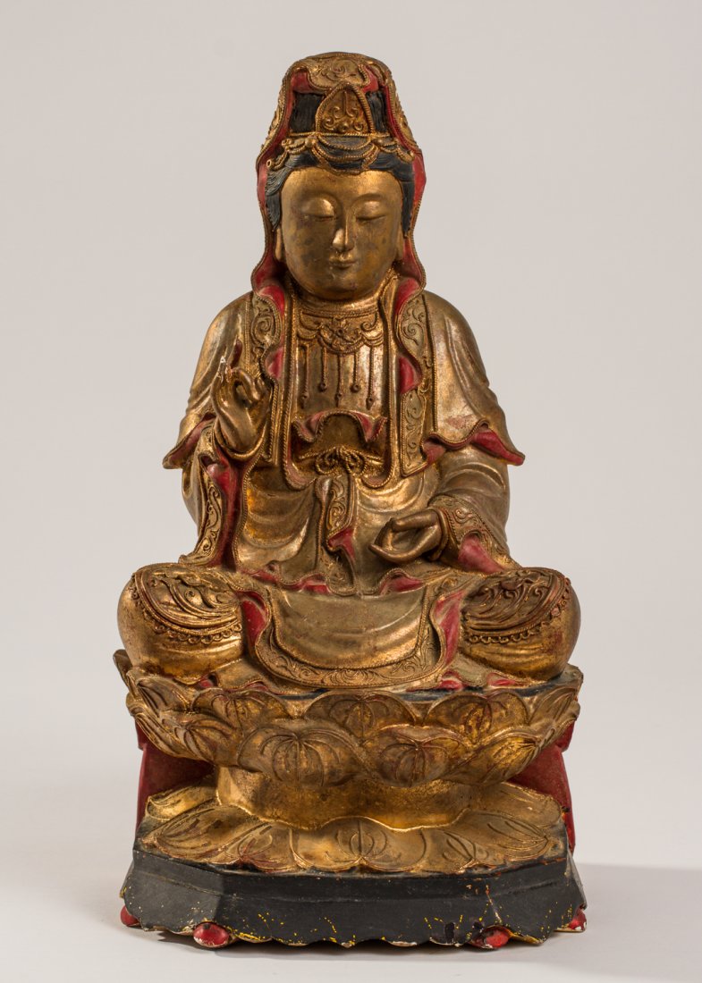 Chinese 19C Carved Wood Gilt Figure of Deity - Kwan Yin: Chinese 19C Carved Wooden Gilt Figure of Buddhist Diety - Kwan Yin. The 19th century figure has a gilt finish on a red ground with black hair and applied wired decoration. The figure is seated upon a 