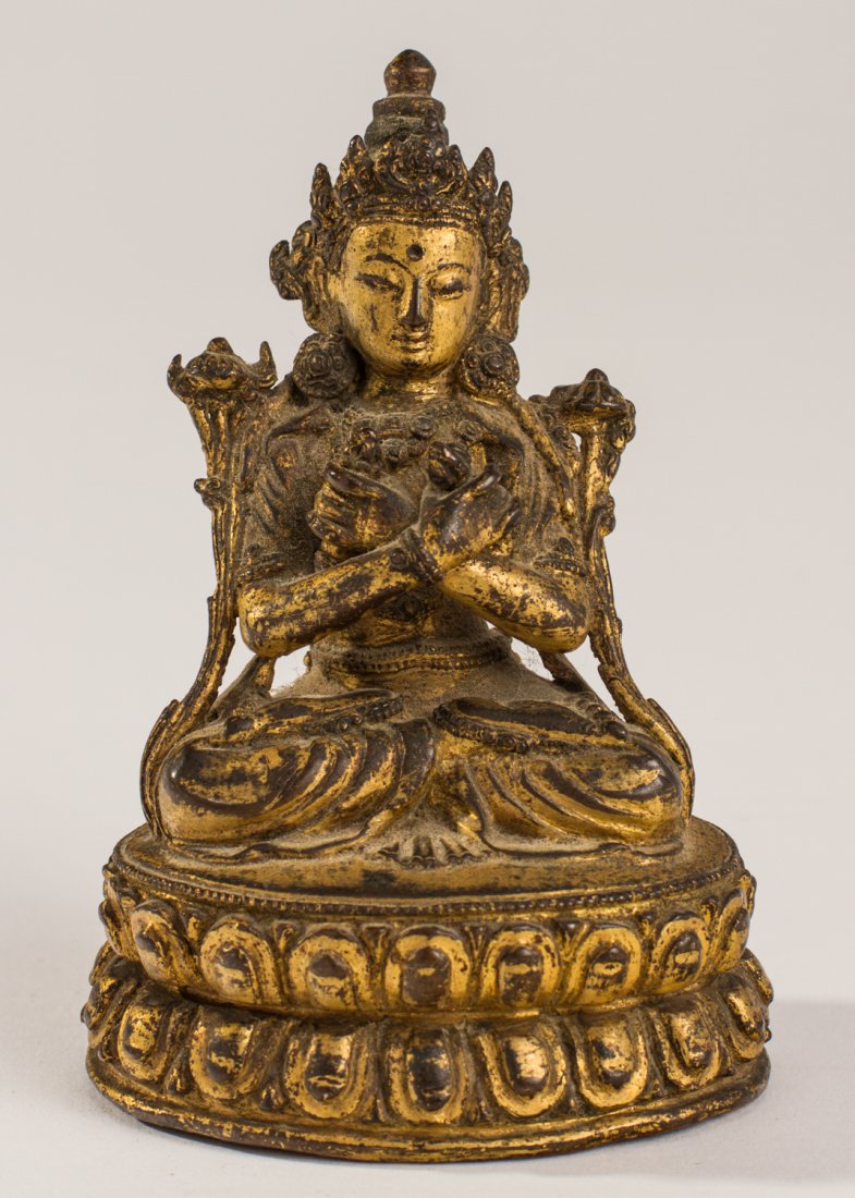 Chinese Gilt Buddhist Bronze Seated Tara Sculpture: Chinese Gilt Bronze Seated Tara Sculpture. The seated figure of the Tibetan or Chinese Tara is in a lotus position and seated on a lotus form stand. The inside of the base has a copper engraved design