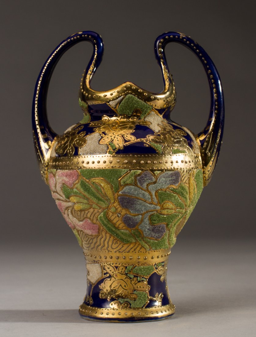 Nippon Coralene Decorated Japanese 1909Floral Vase: Handpainted Nippon Coralene Decorated Vase. Tall shaped handle vase is decorated with an encrusted coralene glass bead decoration of iris flowers encircling the body of the vase. The double-handed low