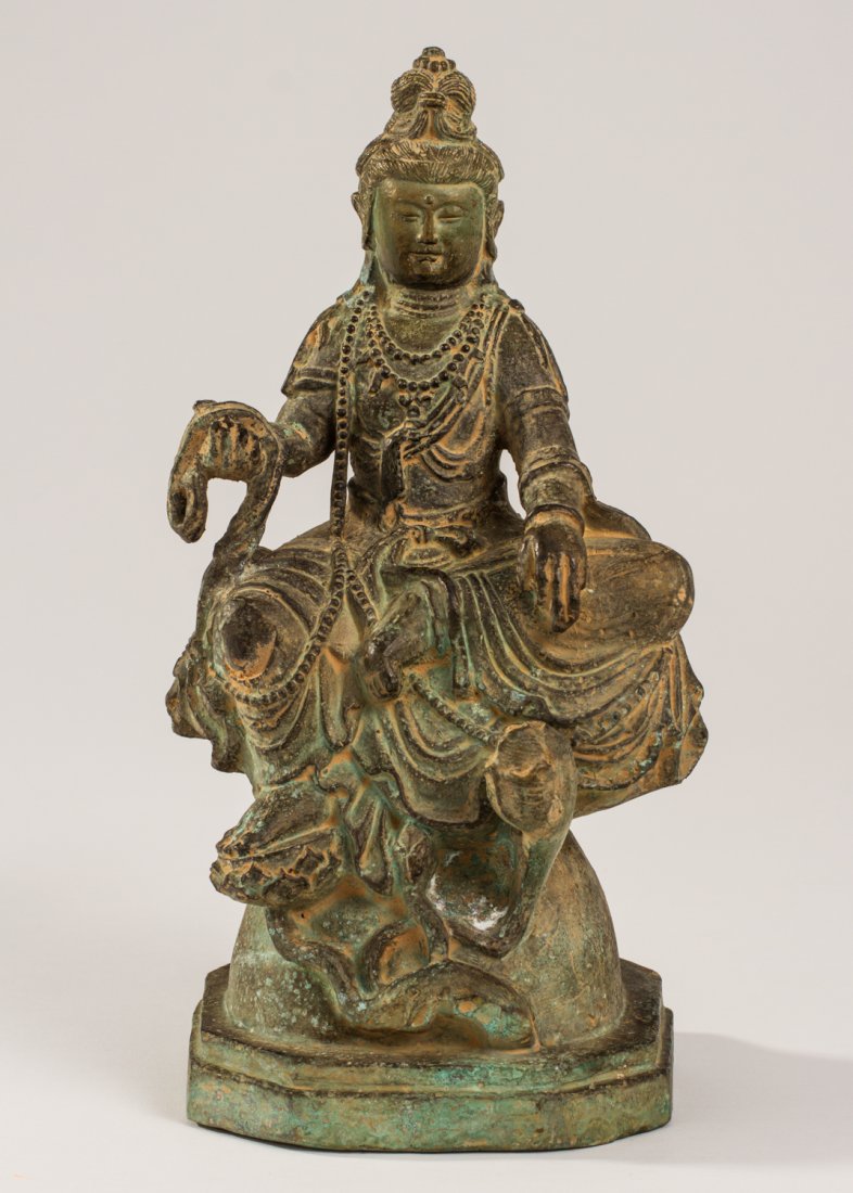 Buddhist 19C Asian Bronze Kwan Yin 11" Sculpture: Bronze Kwan Yin Sculpture. The late 19th or early 20th century bronze sculpture is encrusted with dirt and has a green patina. Finely made. Measures 11.5 inches in height and 5.5 inches in width.