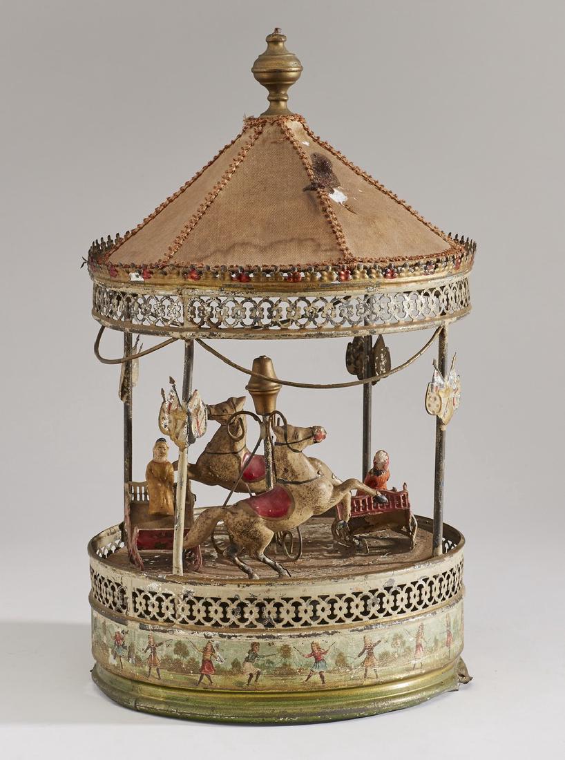Old 19C Tin Lithographed Musical 15 inch Carousel Toy: Old !9C Tin Lithographed Musical Carousel. The old 19th century toy is a real survivor. Considerable paint loss, holes in the cloth top, lacking the musical mechanism and not in working order. Sold as