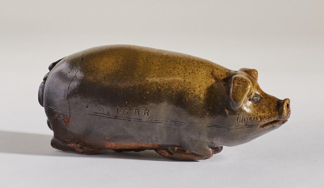 Stoneware Anna Brown Pig Flask Illinois Central RR: Stoneware 19C Anna Brown Pig Flask Illinois Central. The 19th century pottery pig is incised, lard oil drill, Cairo mounds and I. C. RR for Illinois Central Railroad. There is a crack around the body.