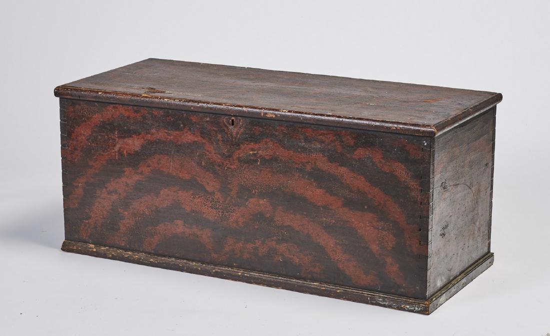 Red 19C Grain Painted Blanket Chest Box: Red 19C Grain Painted Blanket Chest Box. The 19th century dovetailed red and black grained blanket box has a wallpaper interior with original till and strap hinges. The box is lined with old newspaper
