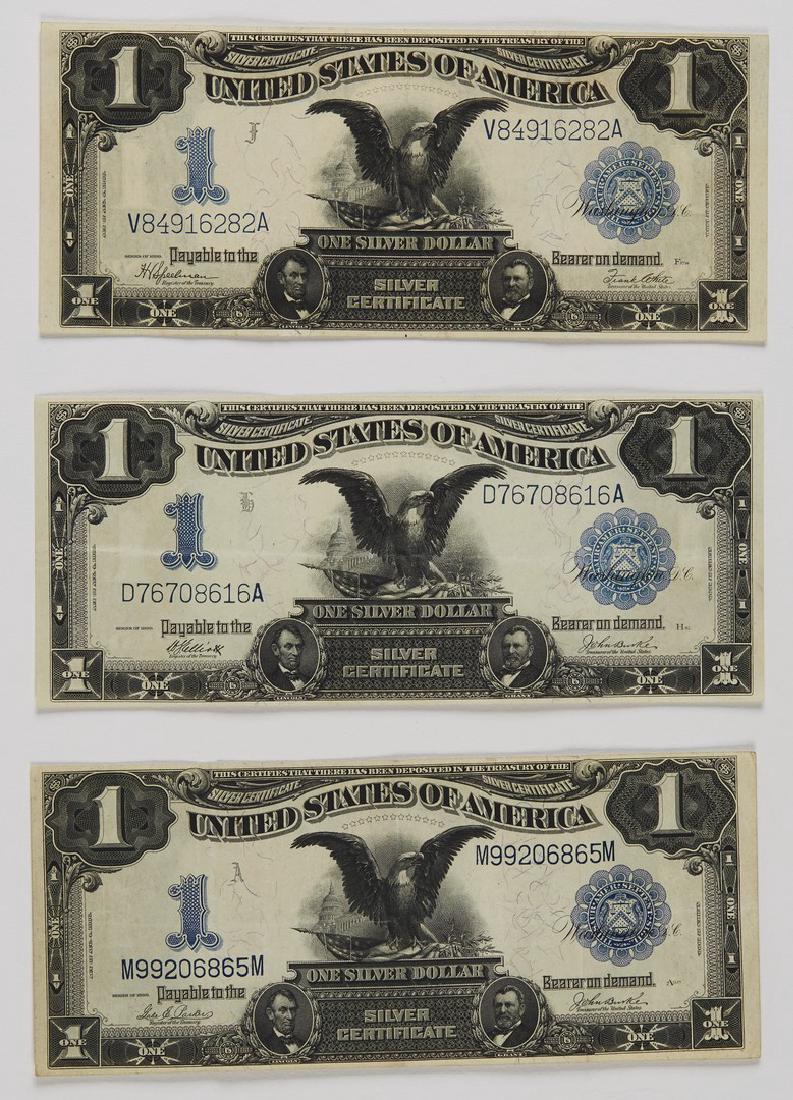 Three 1899 One Dollar Black Eagle Silver Certificate: Three 1899 One Dollar Black Eagle Silver Certificates. The American paper silver certificate currency is being sold together as group. One bill in excellent condition, one with light fold marks, the o