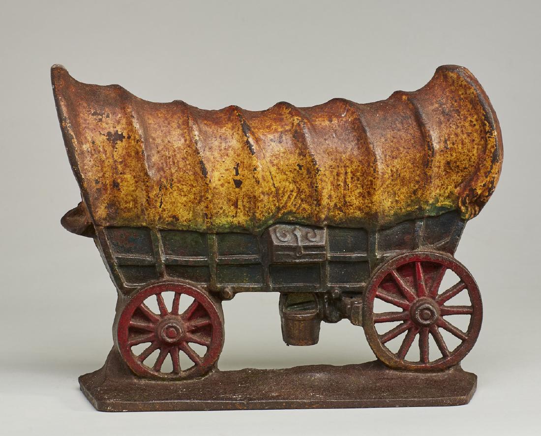 Old Cast Iron Figural Covered Wagon Doorstop: Old Cast Iron Figural Covered Wagon Doorstop. The figural door stop has wear from normal use and oxidation. Measures 8.2 inches high and 11 inches long. Notes: Thank you for your bid! Please keep in m