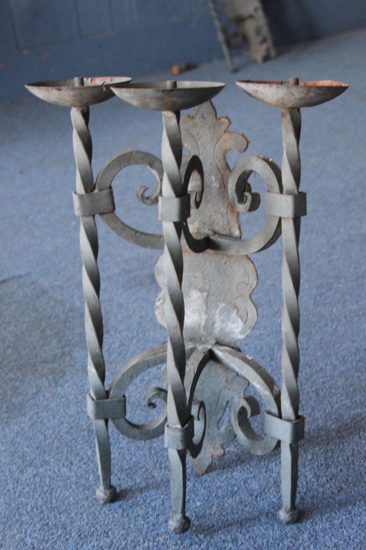 Antique Hand Wrought Iron Wall Sconce Three Light: Antique hand wrought iron three light wall sconce. Can be wired for electricty. Measures 20 1/2" tall by 14 1/2" wide.