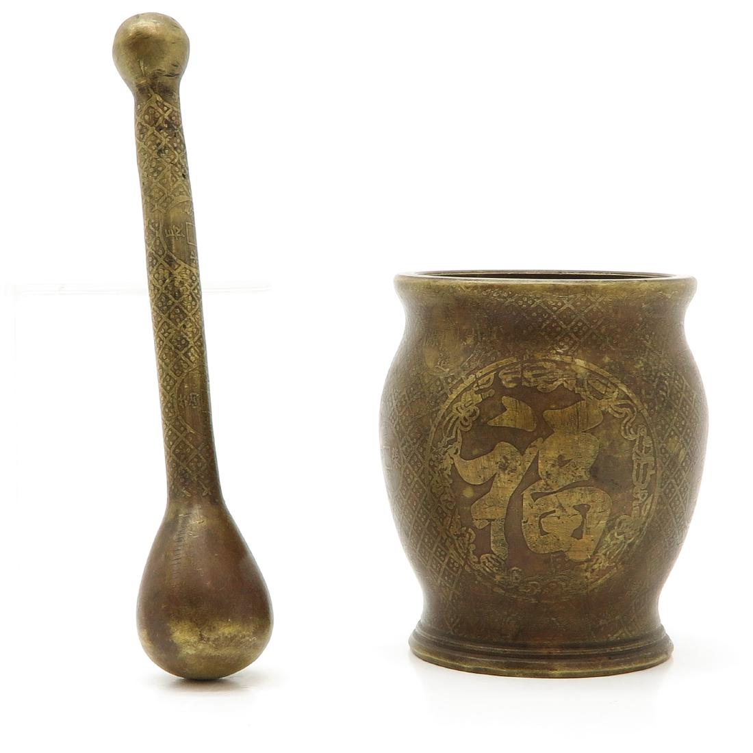 Mortar and Pestle: Bronze, 11 cm. tall.