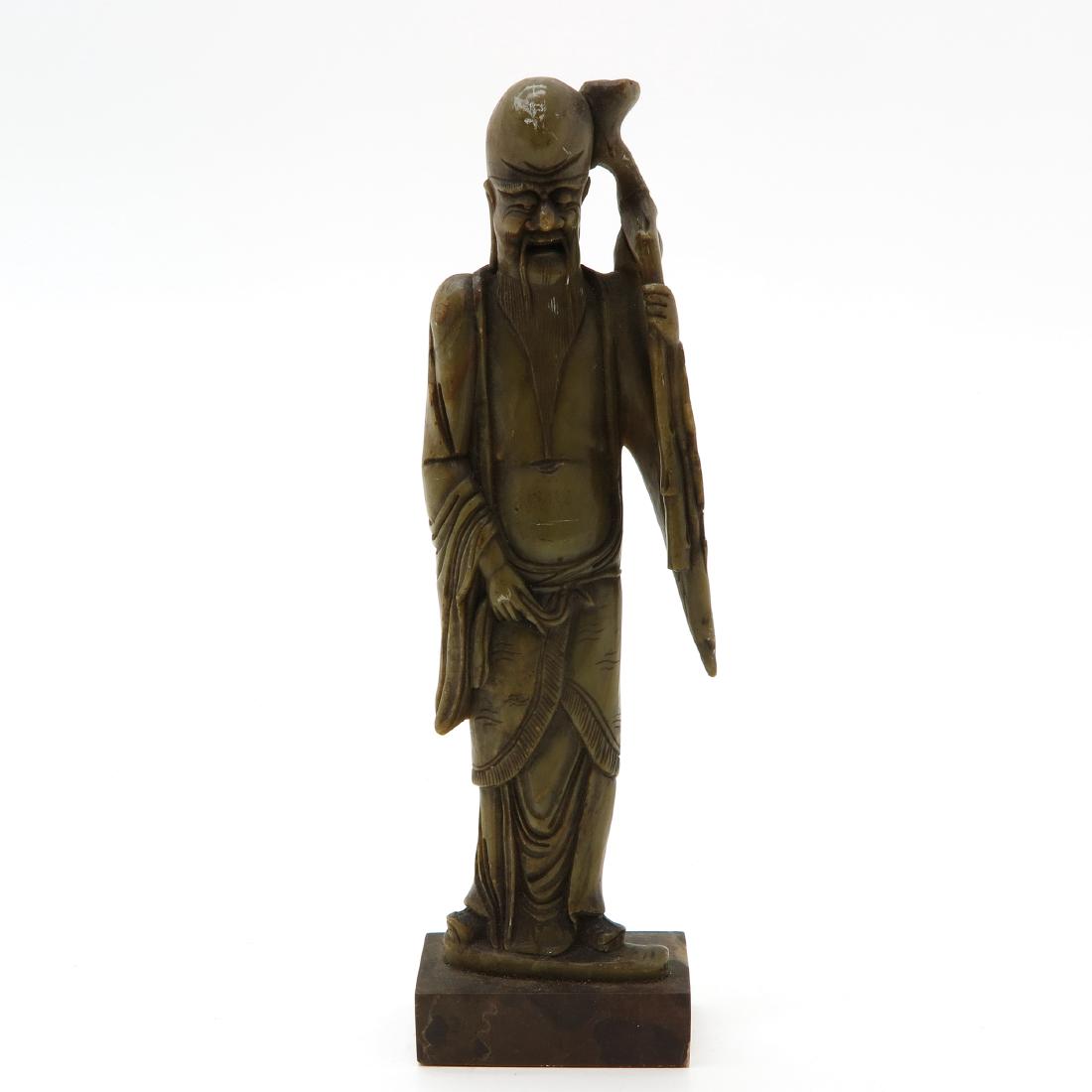 Soapstone Sculpture: Depicting man with staff, 25 cm. tall.