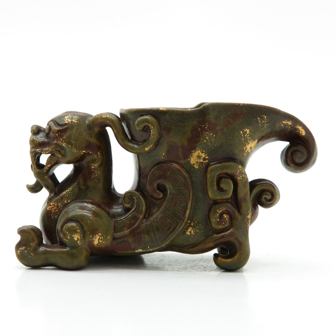Sculpture: Depicting a dragon, gold flake decor, marked with seal mark on the bottom in gold, 10 x 7 x 19 cm.