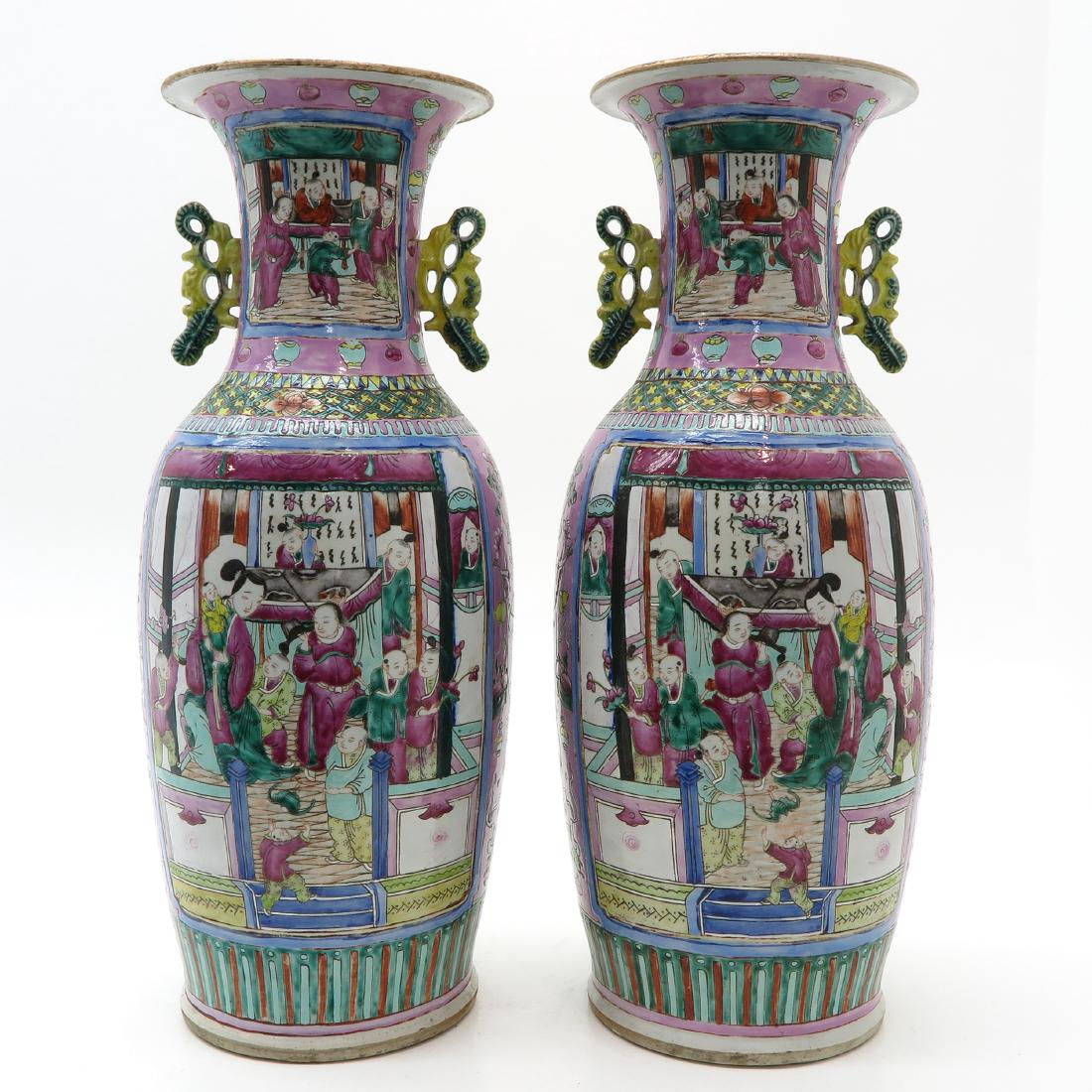 Pair of Vases: Canton, 60 cm. tall, chip on stand ring.