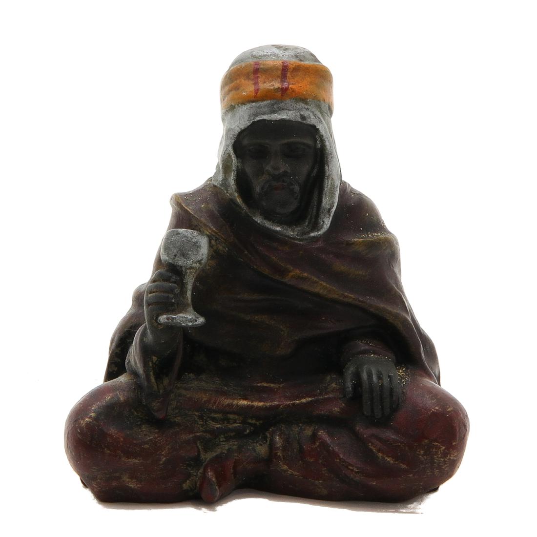 Cold Painted Bronze Sculpture: Depicting man holding glass, 7 cm. tall.