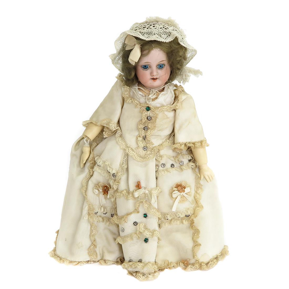 Armand Marseille Doll: 19th Century, marked 390 A 7/0 M, porcelain head, open mouth with 4 upper teeth and blue eyes, 28 cm. tall, restored.