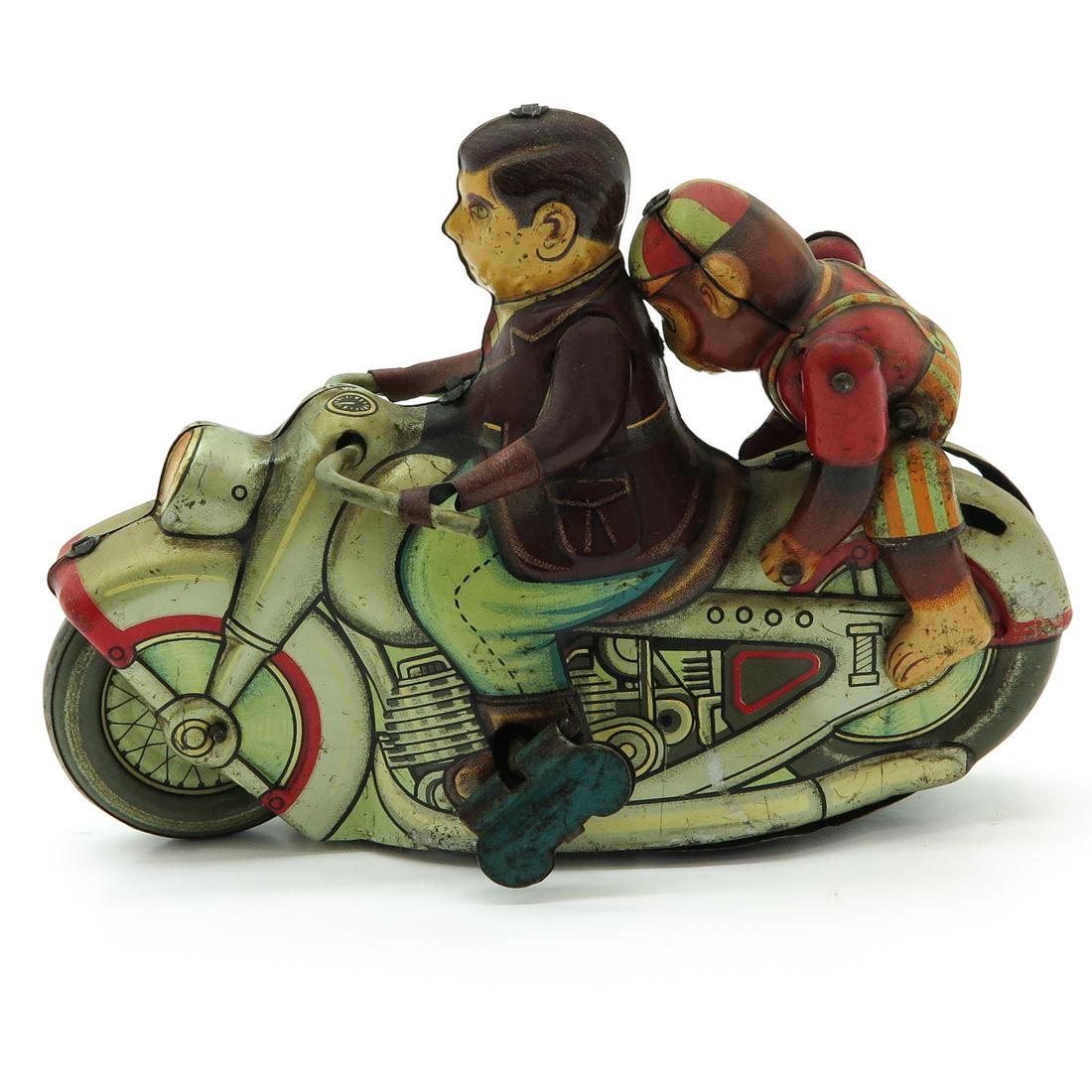Vintage Tin Toy Motorcycle with Monkey: Made in Japan, 15 cm. long.