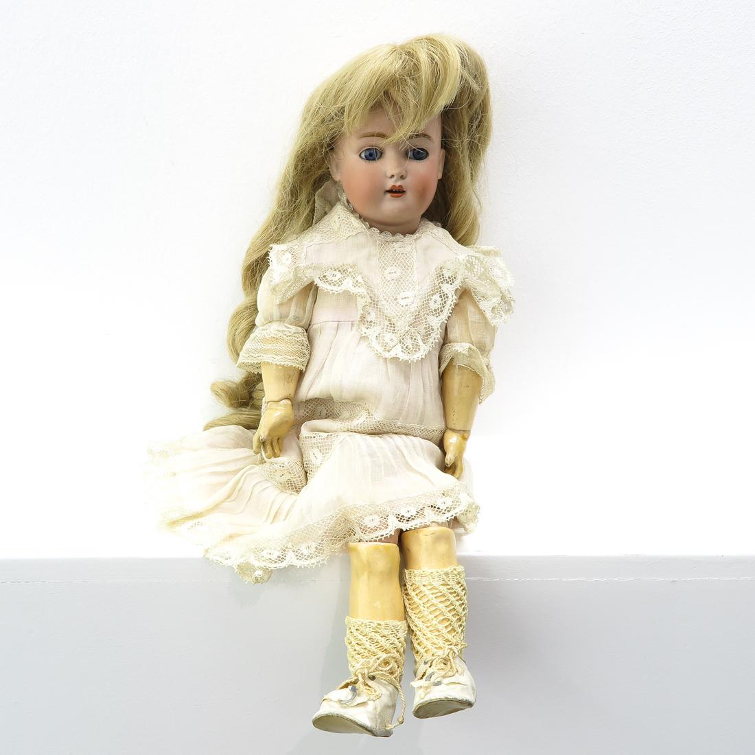 Kestner Doll: 19th Century, marked 171, porcelain head with composition body, open mouth with 4 upper teeth and blue glass eyes, 40 cm. tall.