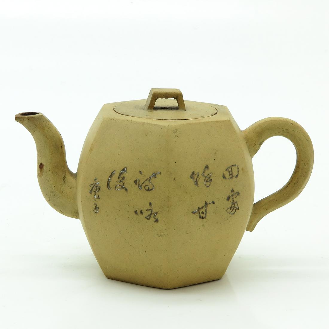 Yixing Teapot: Marked on bottom with seal mark, 11 cm. tall, chip and hairline.