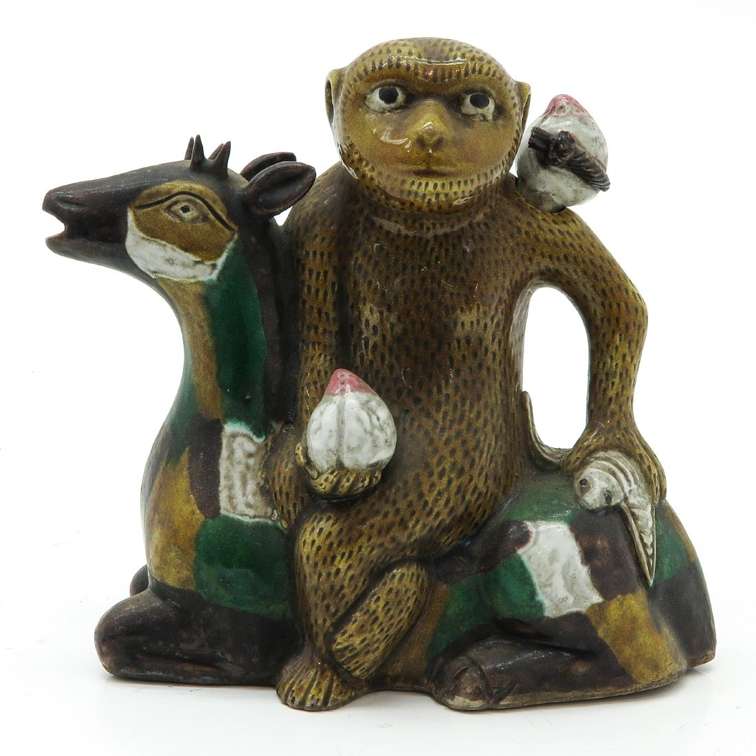 Teapot Depicting Monkey on Deer: 17 cm. tall.