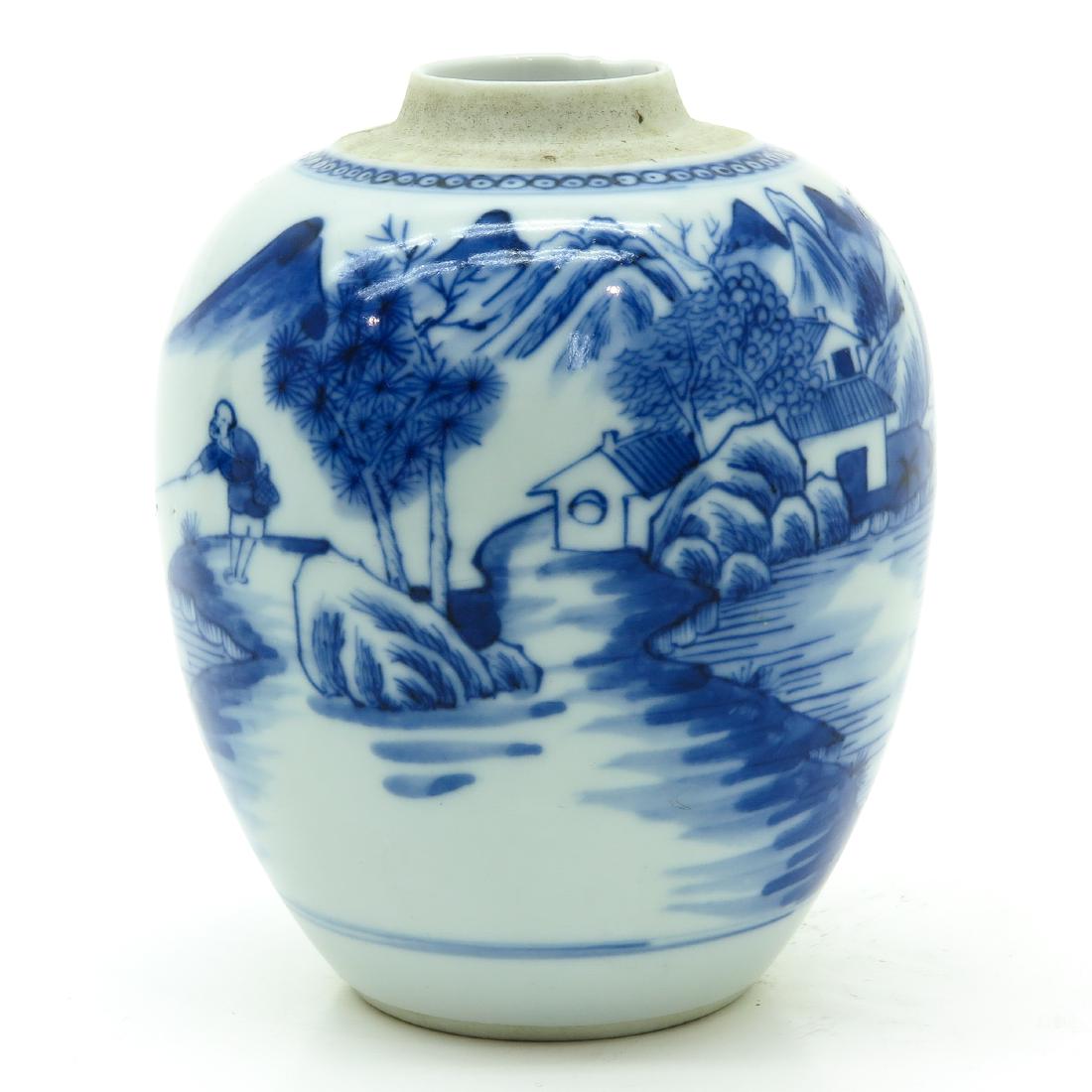 A Blue and White Ginger Jar: Depicting landscape scene with fisherman, marked on bottom with double ring, 14 cm. tall.