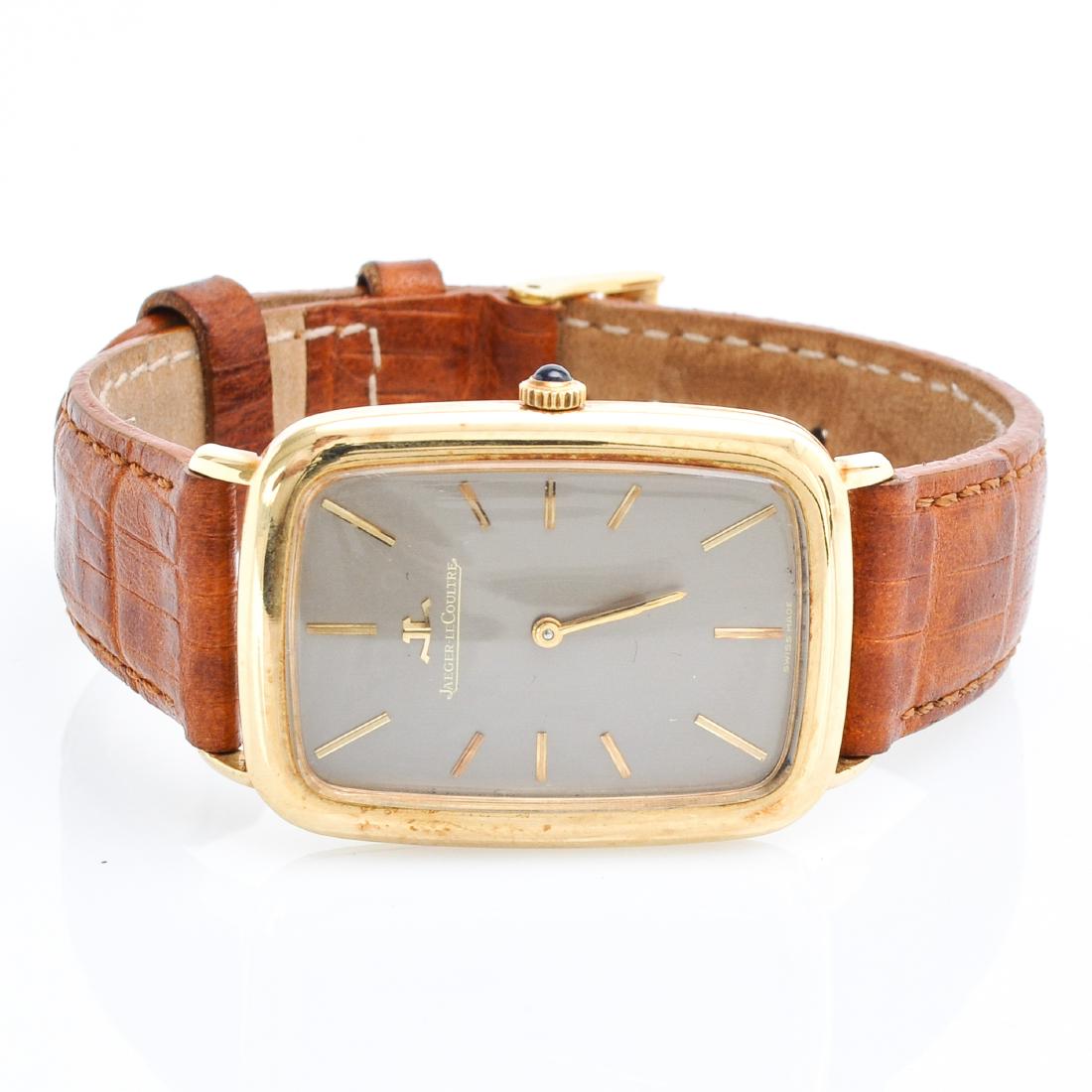 A Mens 18KG Jaeger LeCoultre Tank Allonge Watch: Watch case is approximately 28 x 38 mm.