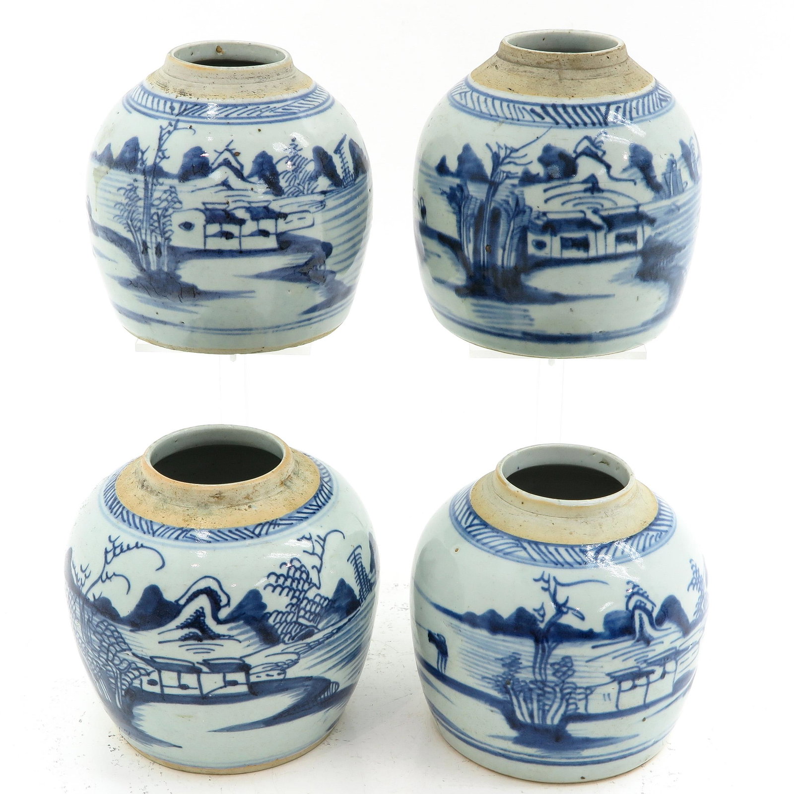 A Collection of 4 Ginger Jars: Blue and white landscape decor, 16 cm. tall, hairline glaze, in bottom.