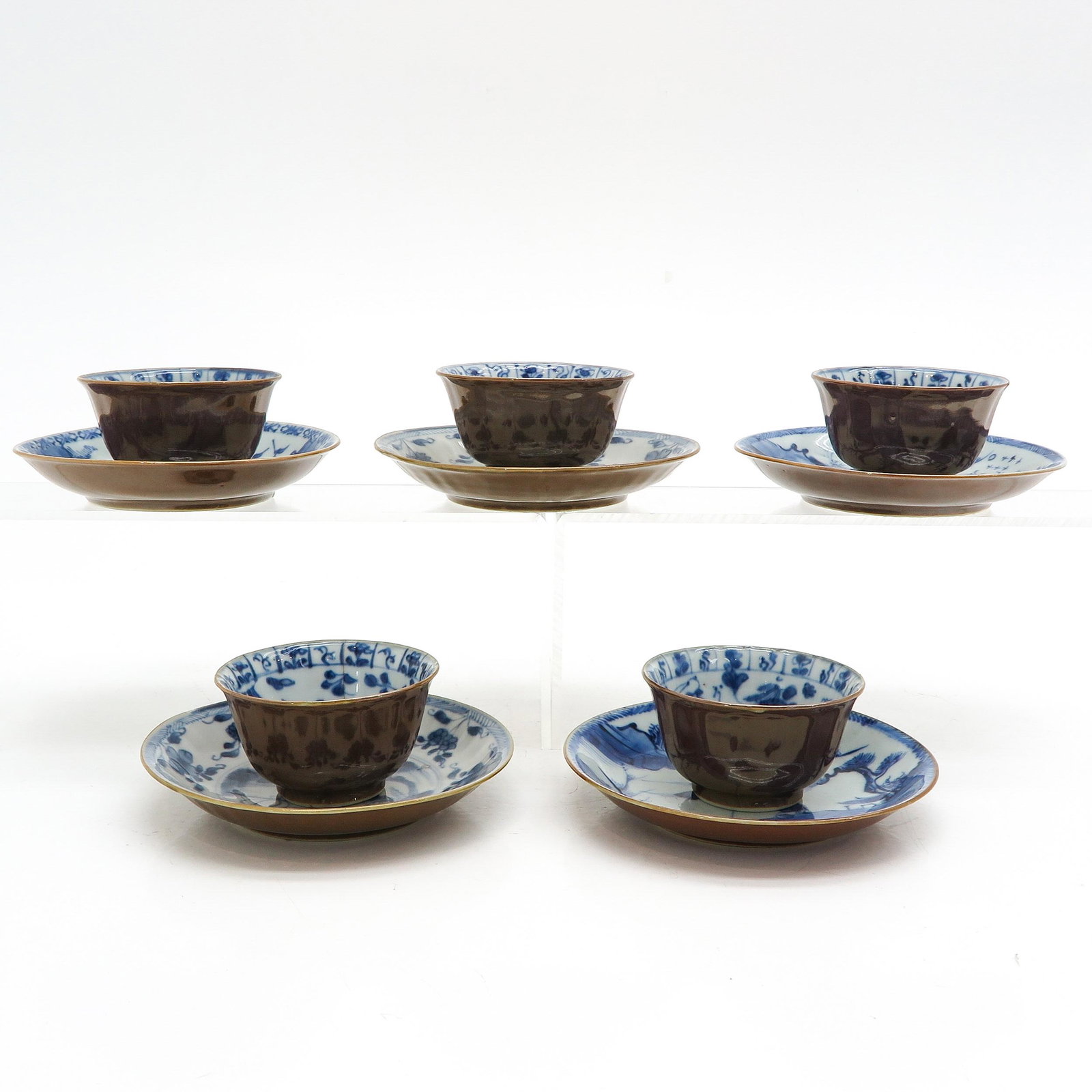 Five Batavianware Cups and Saucer: In diverse decors, 18th Century, saucers are 14 cm. in diameter, chip and hairline.