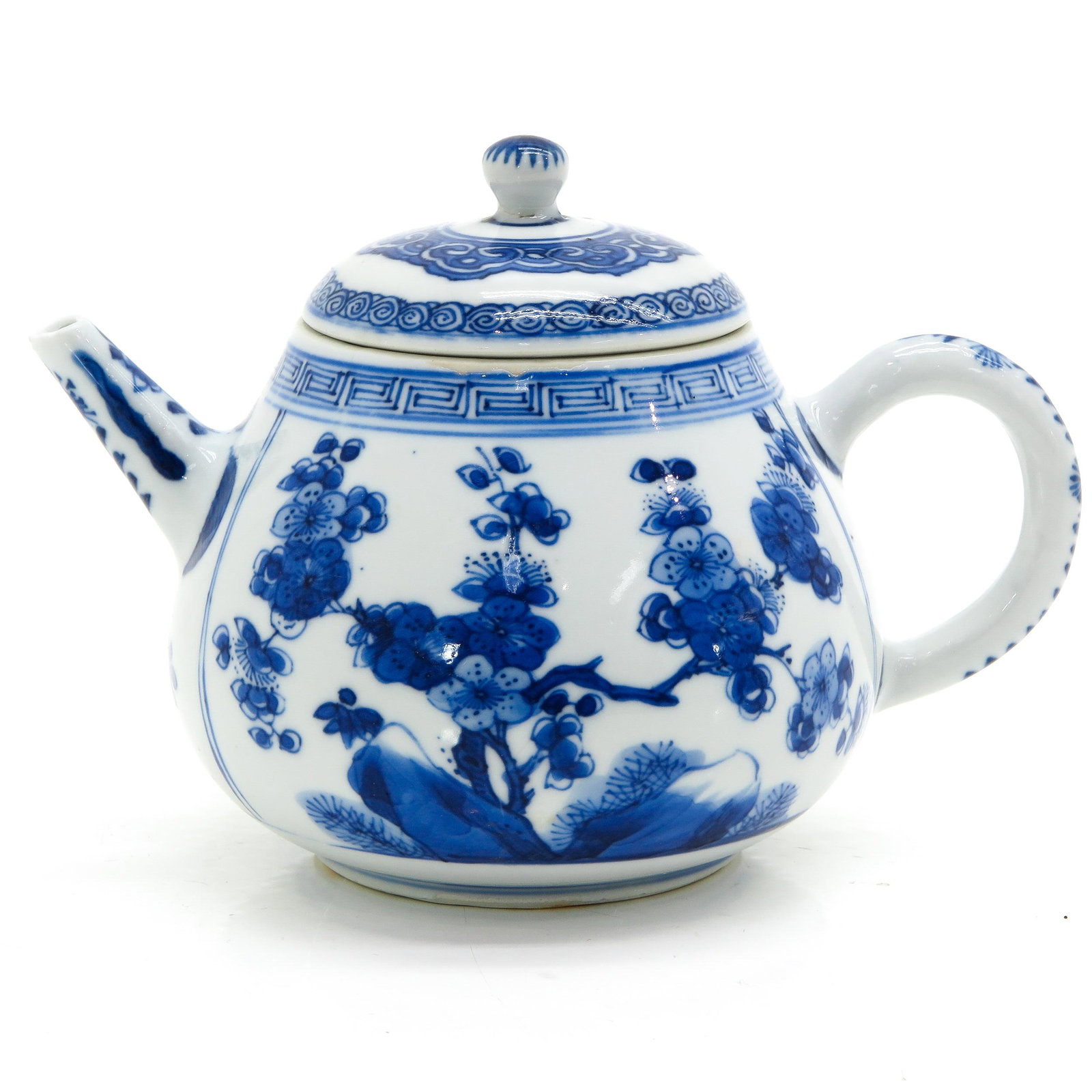 A Blue and White Teapot: Kangxi Period, floral decor, 10 cm. tall, fritting.
