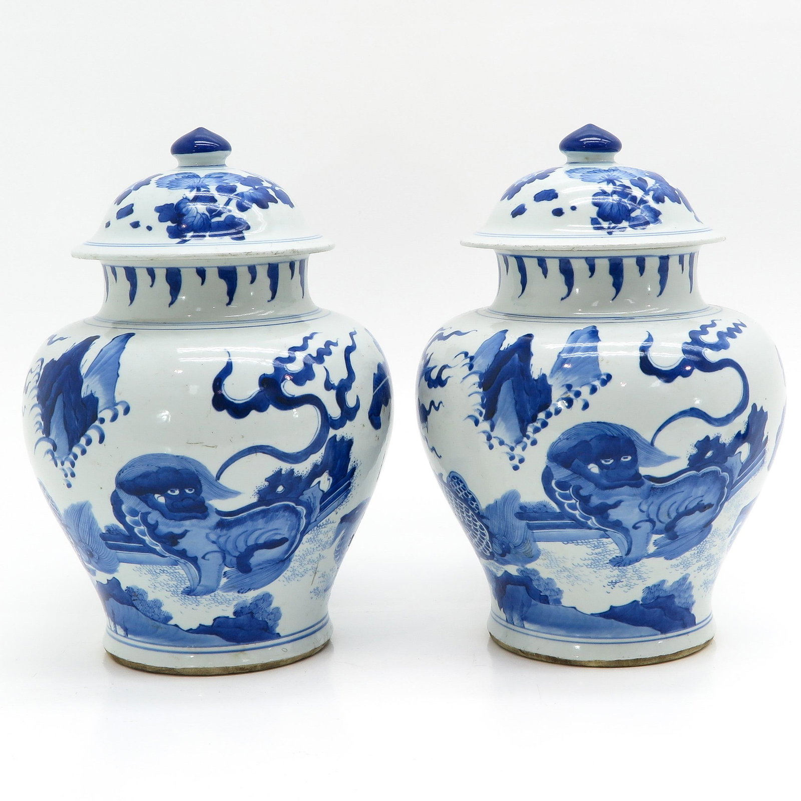 A Pair of Blue and White Jar with Covers: Depicting dragon and kylin, 37 cm. tall.