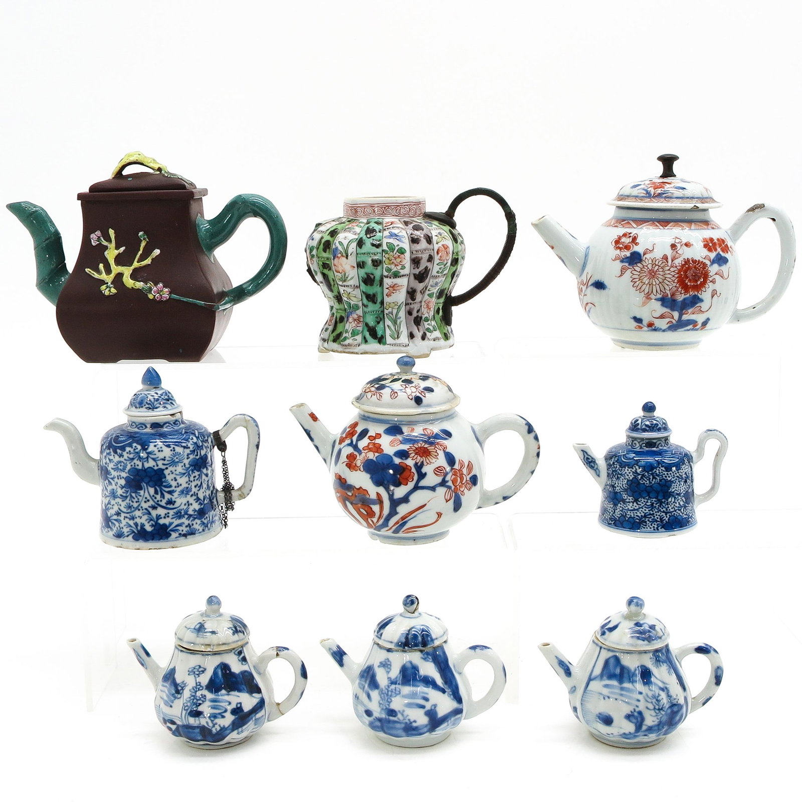 A Collection of 9 Teapots: Diverse decors and sizes, tallest is 14 cm., in diverse conditions.