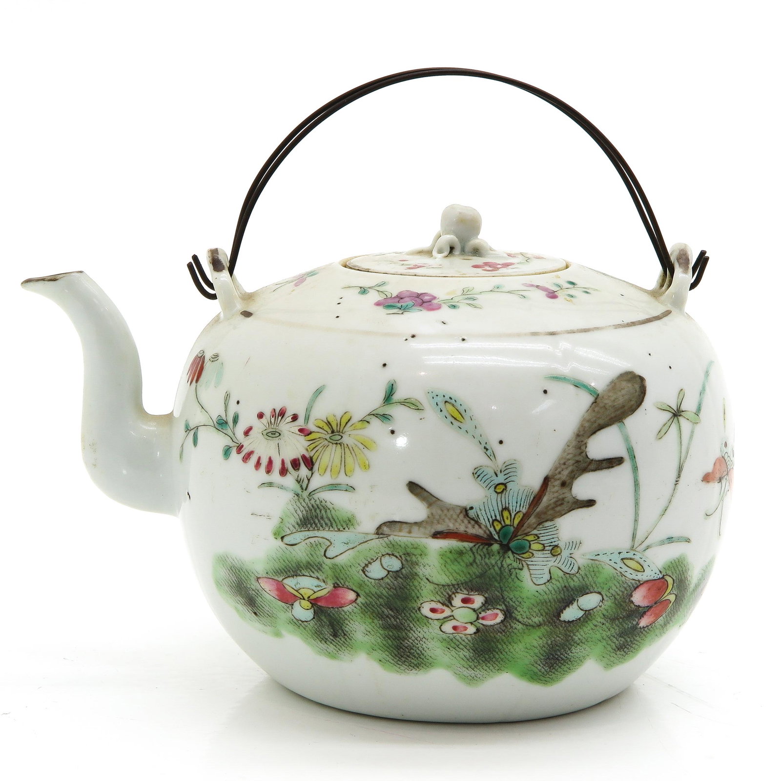 A Famille Rose Teapot: Floral decor with butterflies, marked with seal mark on bottom, 12 cm. tall.