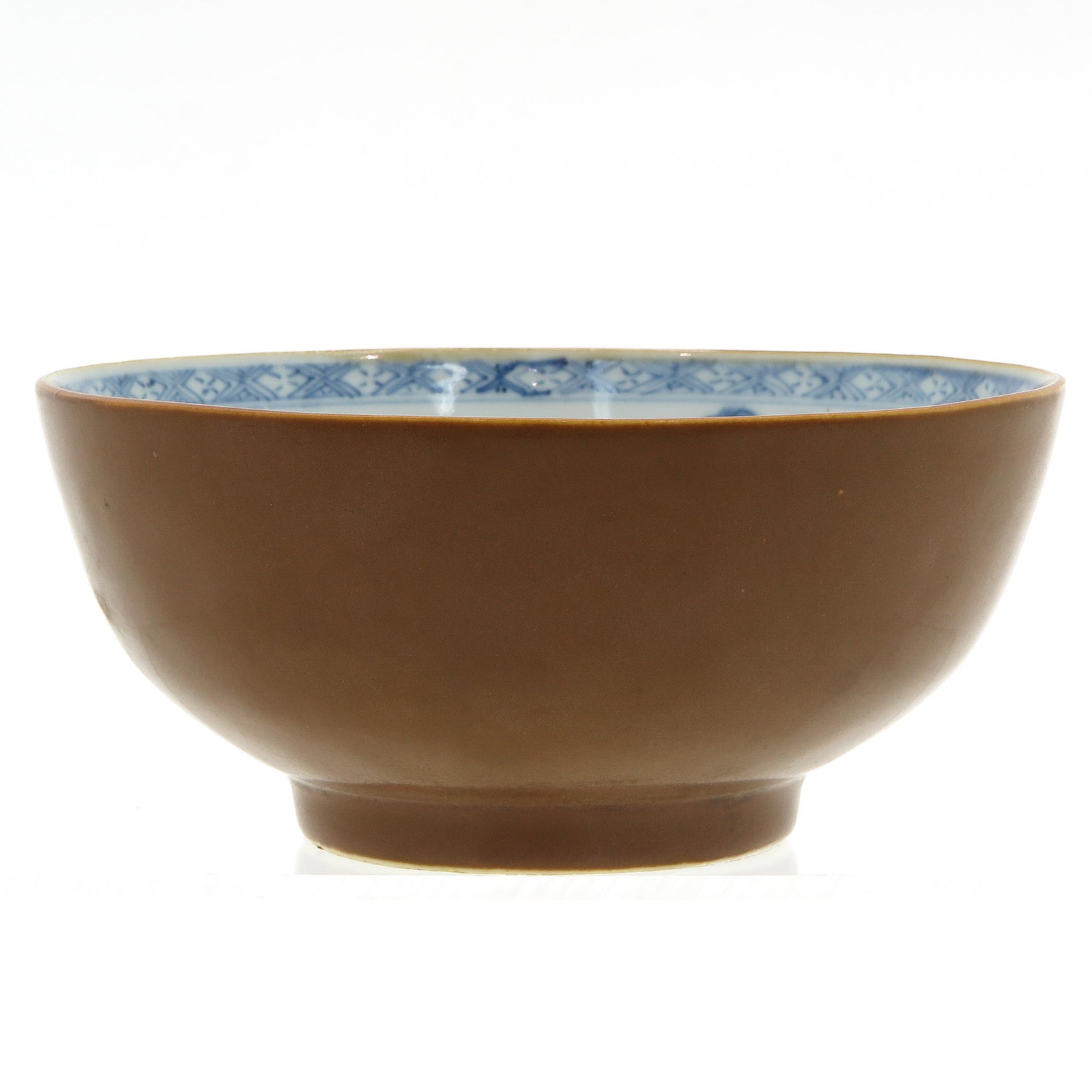 A Batavianware Bowl: Floral decor, Chrisitieâ€™s sticker Nanking Cargo still remaining, 17 cm. in diameter.