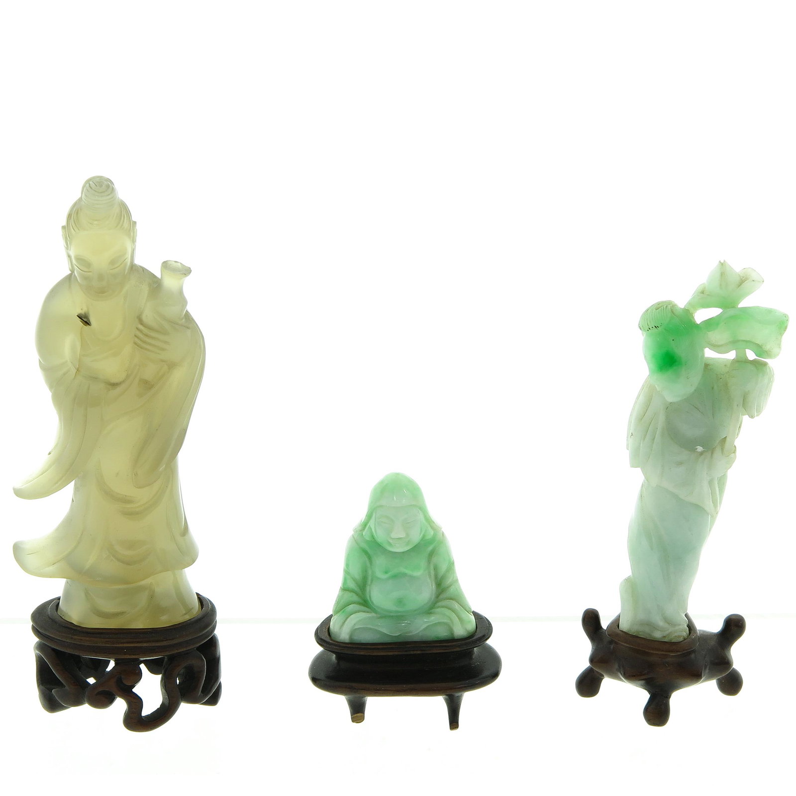A Collection of 3 Carved Sculptures: Including carved jade, Quanyin and Buddha, tallest is 13 cm. including wood base.