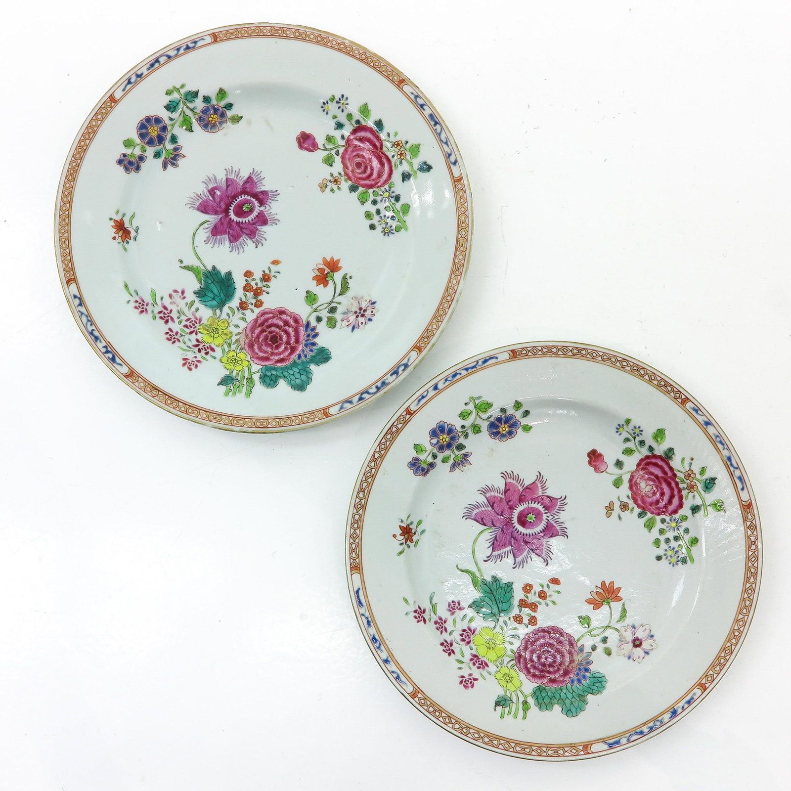 A Pair of Famille Rose Plates: 18th Century, 23 cm. in diameter, fritting.