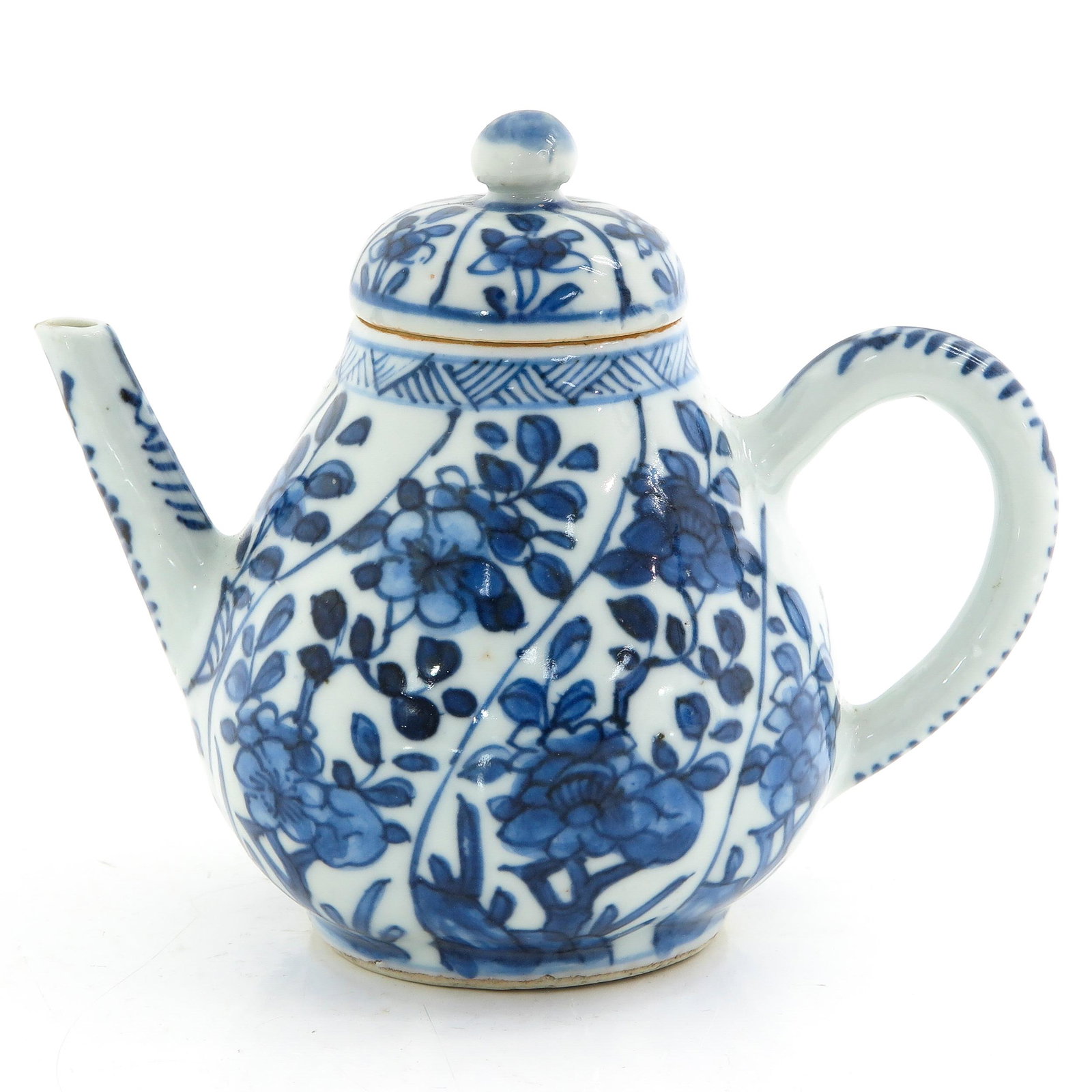 A Blue and White Teapot: Floral decor, 18th Century, 11 cm. tall.