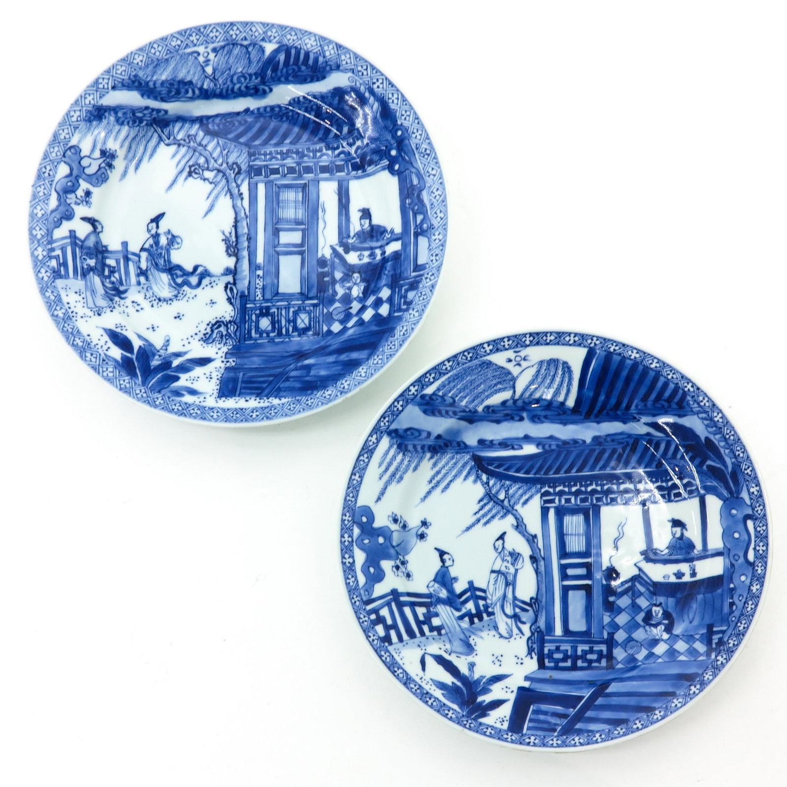 A Pair of Blue and White Plates: Nicely decorated with Chinese figures, 18th Century, 23 cm. in diameter, fritting.