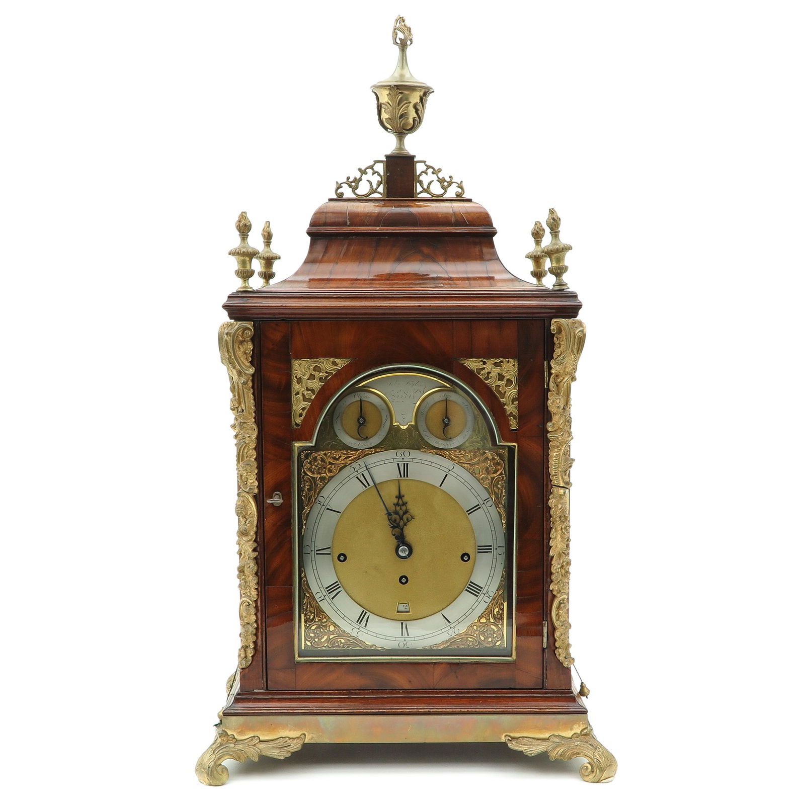 An English Table clock: Impressive in size, height 75 cm., Signed John Taylor, with 6 melodies and 12 bells.