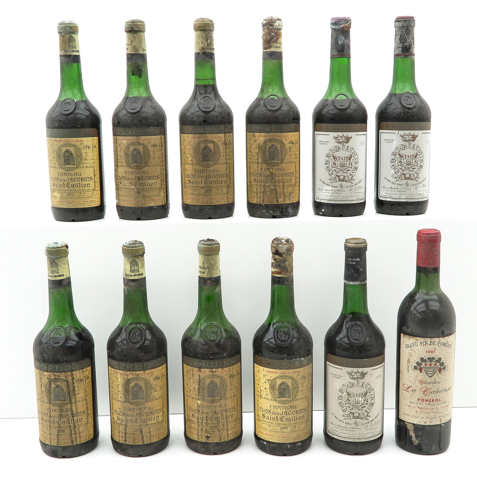 A Collection of 12 Bottles of Wine: consisting of 12 bottles of wine, including Chateau La Cabanne 1961