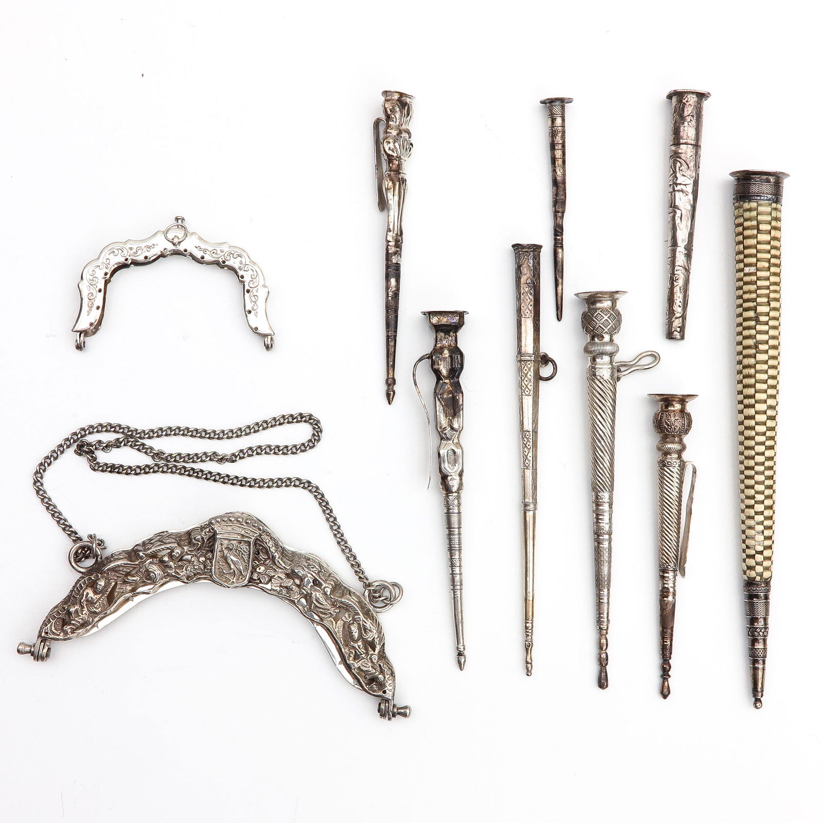 A Diverse Collection of Items: Consisting of 2 needle cases, 2 silver bag brackets, including The Hague, and 6 silver needle cases, the longest 21 cm.