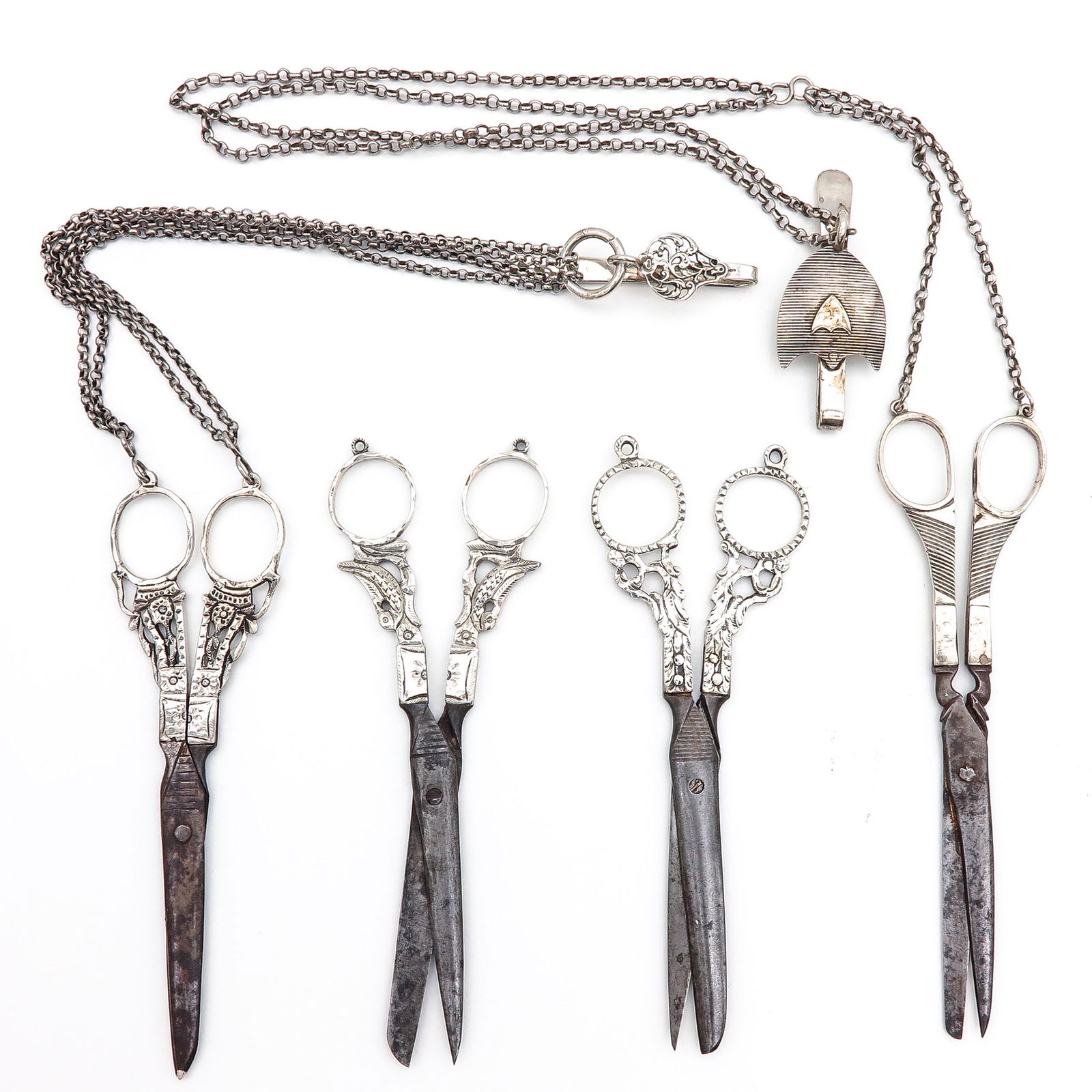 A Collection of Four Silver Scissors (1 of 3)