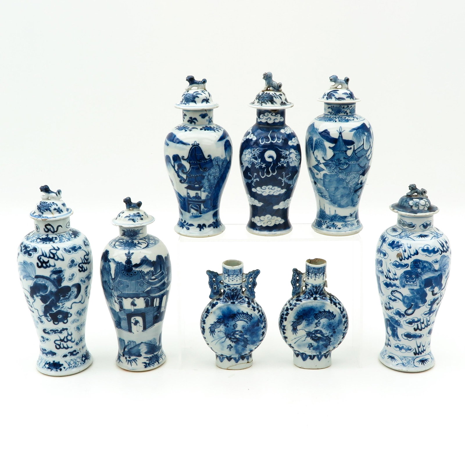 A Collection of 8 Garniture Vases: In various sizes, tallest vase is 27 cm., in diverse conditions.