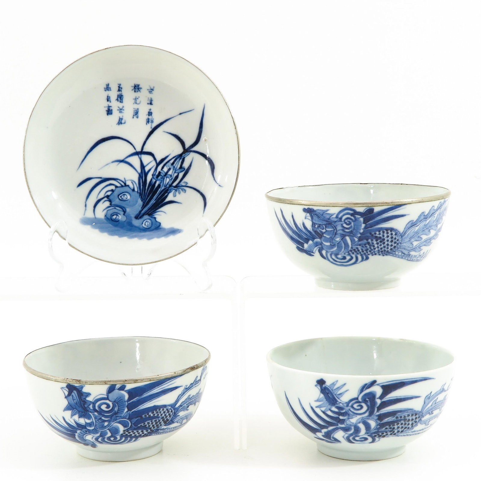 A Collection of Bleu de Hue Porcelain: Produced for the Vietnamese market, Including 3 bowls and 1 small dish, decorated with phoenix, dish is 13 cm. in diameter, in diverse conditions.