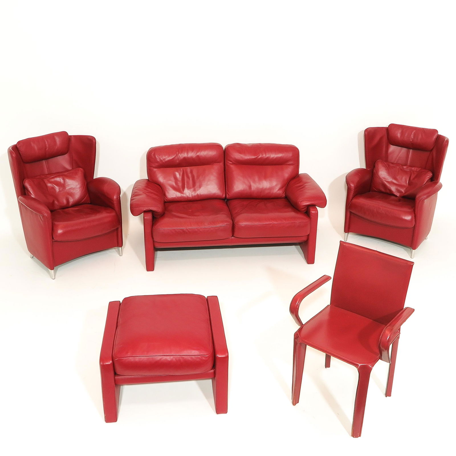 A Collection of Red Leather Furniture: Including 2 Fauteuils De Sede.