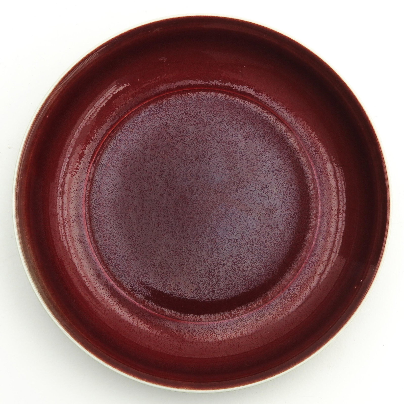 A Sang de Boeuf Dish: Xuande mark, 20 cm. in diameter.