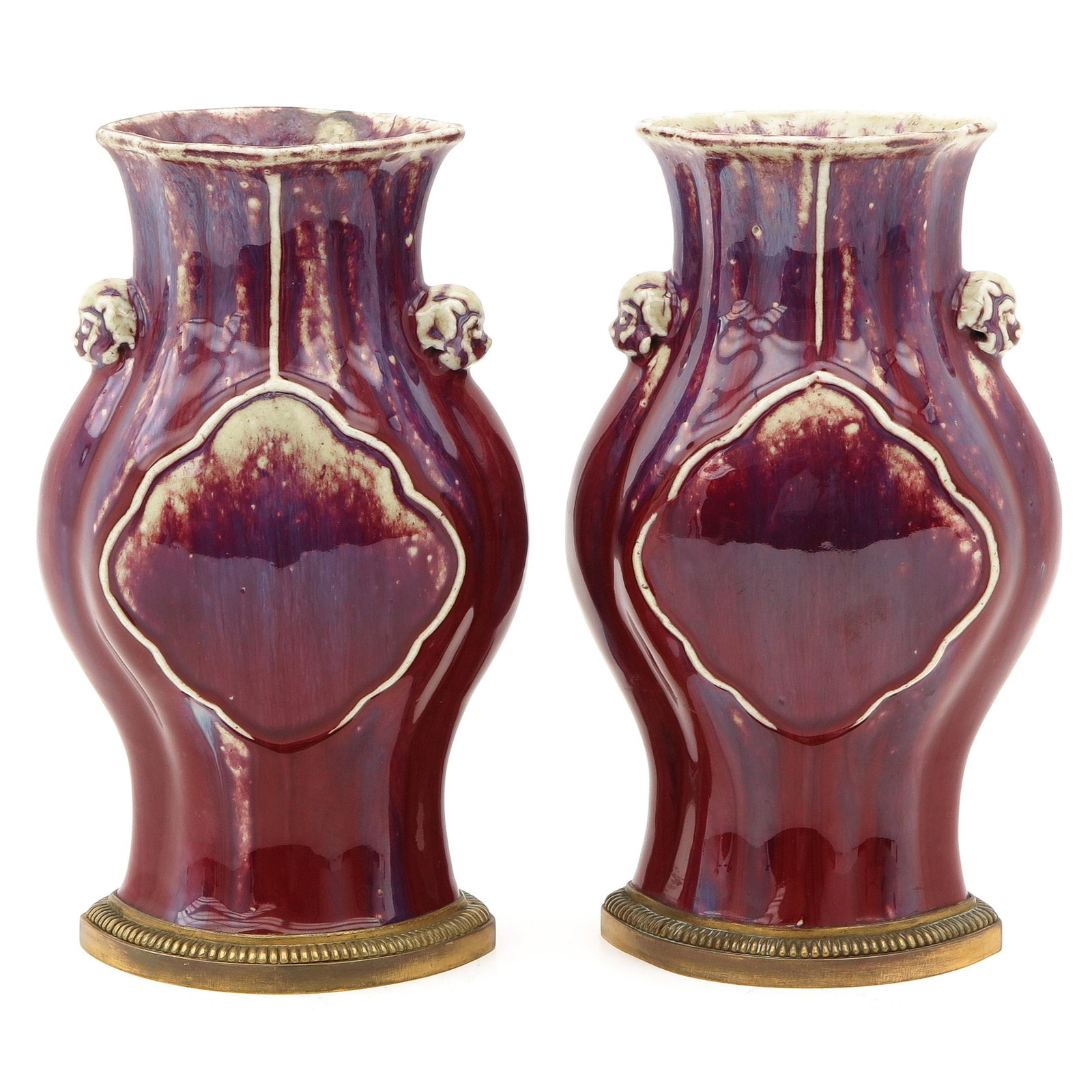 A Pair of Flambe Decor Vases: Bronze fitting for bases, temple lion handles, 27 cm. tall.