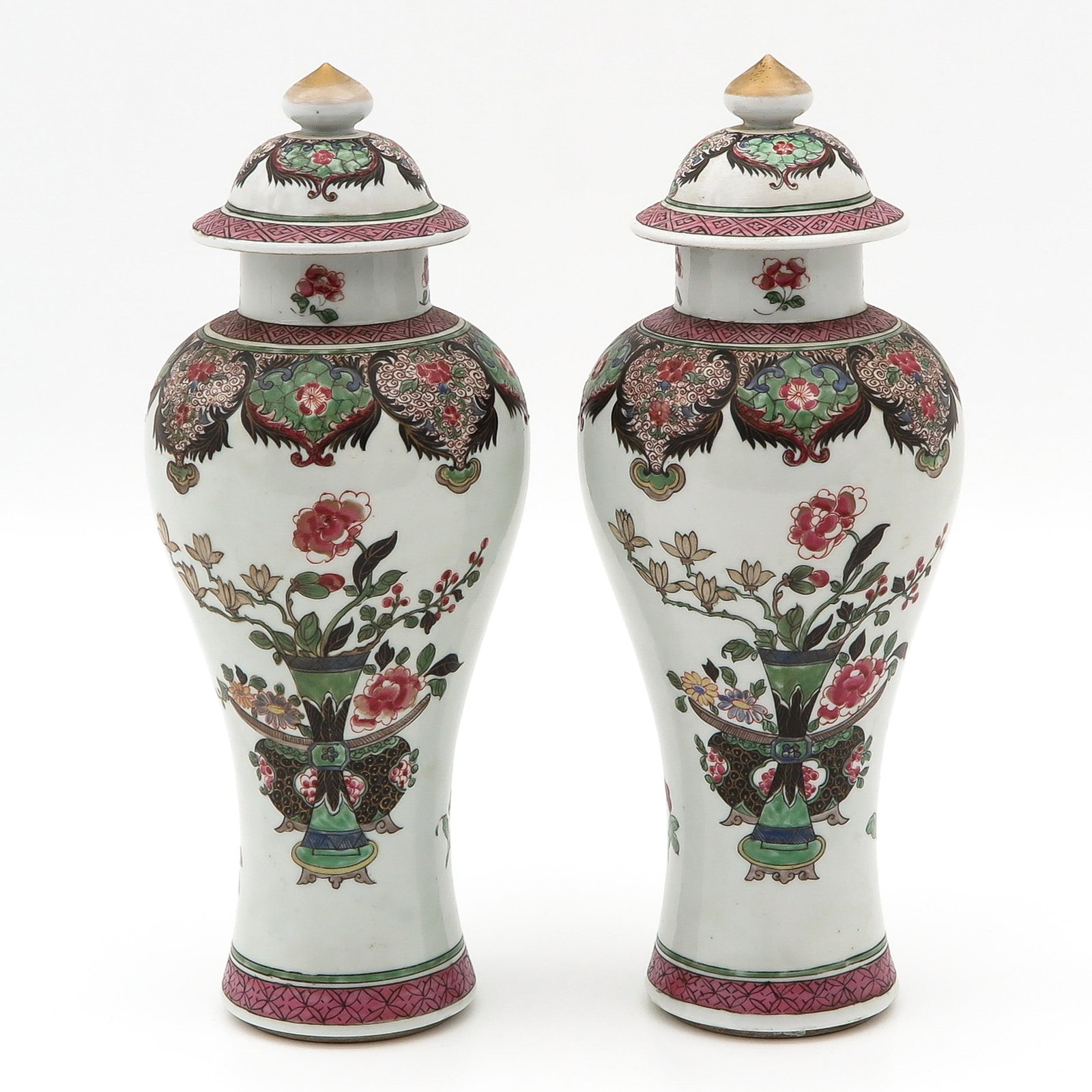 A Pair of Famille Rose Garniture Vases: Floral decors, 32 cm. tall.