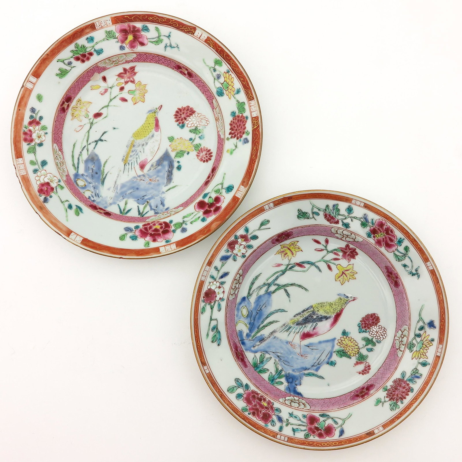 A Pair of Famille Rose Plates: Decorated with birds and flowers, 23 cm. in diameter, fritting on edges.