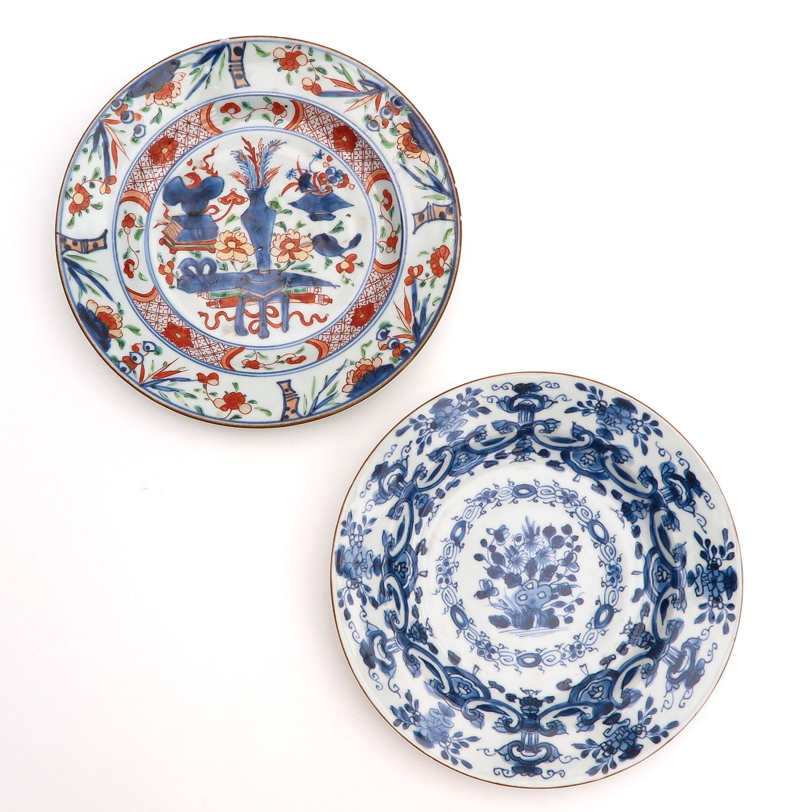 A Lot of 2 Plates: Polychrome and Blue and White decors, 23 cm. in diameter.